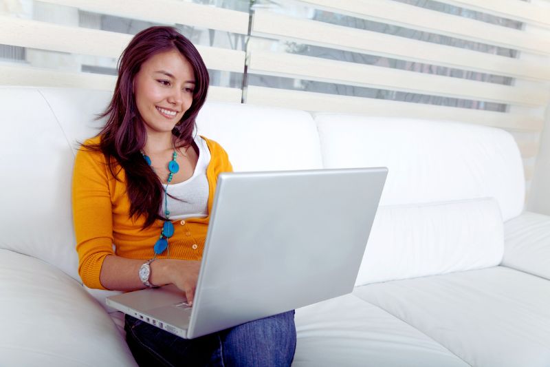 female sitting with a laptop